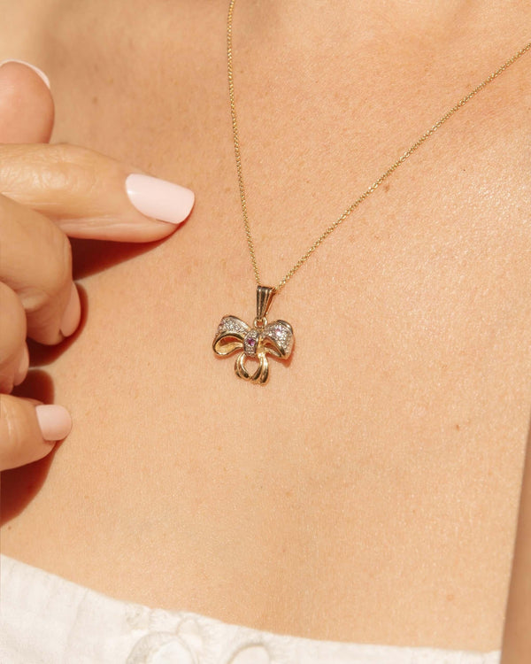 Vintage Circa 1990s Diamond Bow Pendant 9 Carat Gold